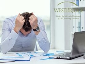 Anxiety Wounds Stressed Businessman with Papers.WBBlog4