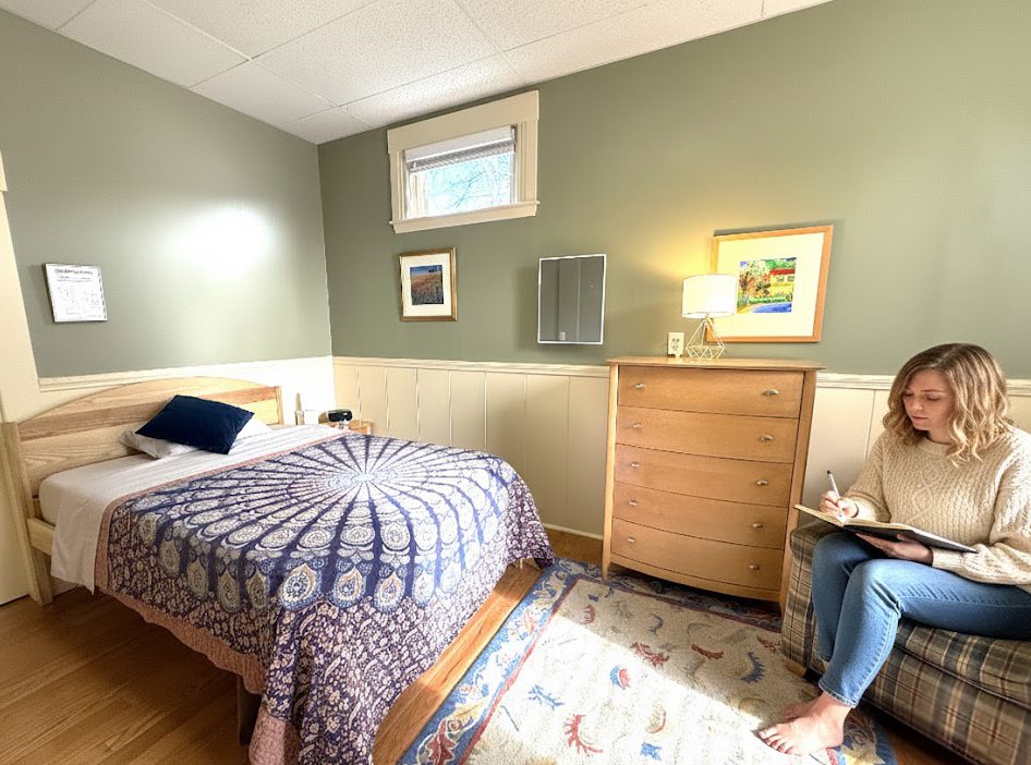 Woman writing in a room